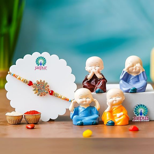Webelkart Premium Rakhi for Brother with Gift - Set of 1 Designer Rakhi With Set of 4 Miniature Buddha Monk Figurines Showpiece For Home With Chawal And Greeting Card