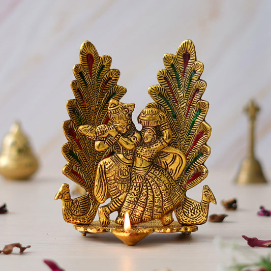 Webelkart Premium Metal Peacock Design Radha Krishna Idol Showpiece for Home Decor with Diya for Puja and Home Decor (6.6 Inches, Gold)